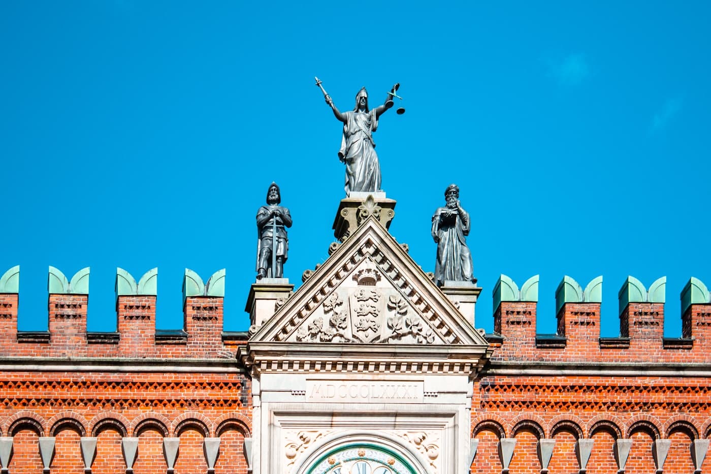 A statue of Lady Justice on a courthouse